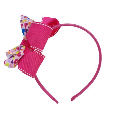 Diadema con chonga rosada con estampado para niña