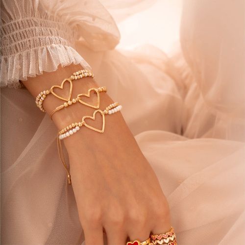 Set de pulseras + aretes en color dorado para mujer