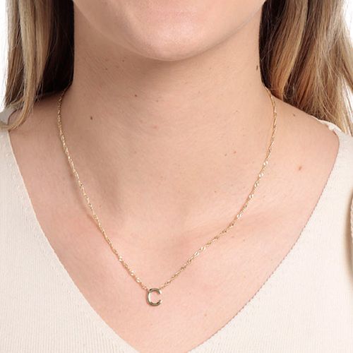 Set de cadena con letra y aretes Nes de brass en dorado para mujer