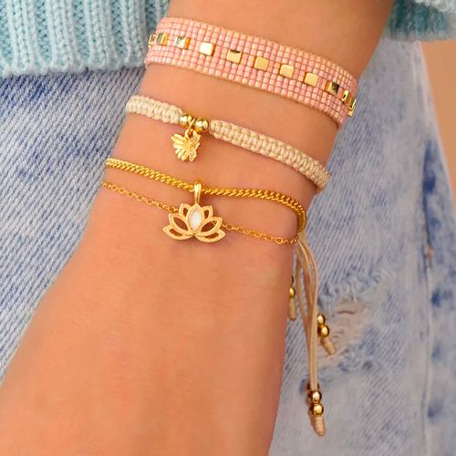 Set de 4 pulseras flor lotto + aretes en dorado para dama