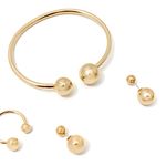 104720469-Conjunto-de-aretes-y-pulsera-dorado-para-mujer