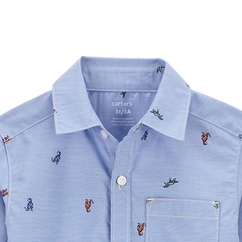 104729210-Camisa-celeste-con-estampado-de-dinosaurios-para-niño