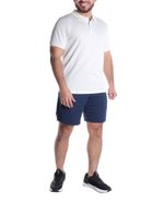 104746911-Camiseta-deportiva-tipo-polo-Umbro-blanca-para-hombre
