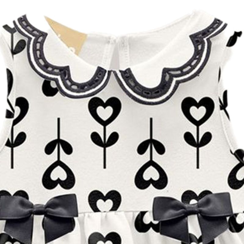 104824118-Vestido-blanco-con-estampado-para-niña