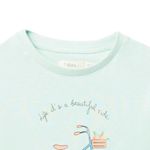 Blusa-verde-con-estampado-para-niña-104831729