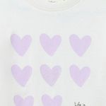 Blusa-blanca-con-estampado-de-corazones-para-niña-104831911