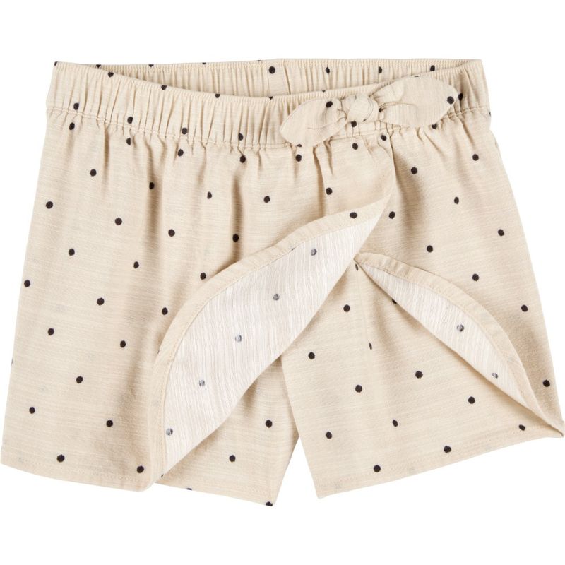 Falda-short-beige-con-puntos-para-niña-104840843