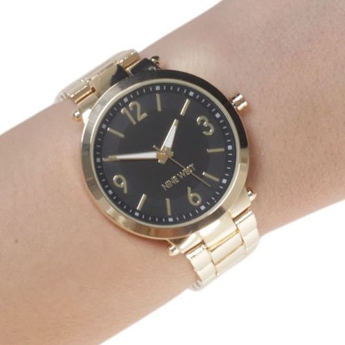 Reloj Nine West análogo de metal dorado para mujer