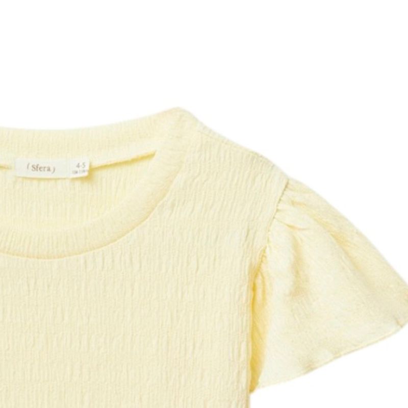 Blusa-amarilla-solido-para-niña-104872150