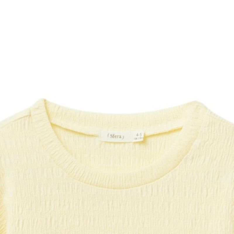 Blusa-amarilla-solido-para-niña-104872152