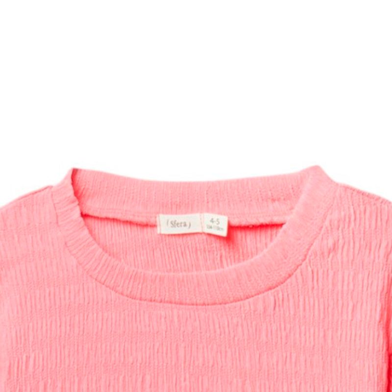 Blusa-rosada-solido-para-niña-104872160