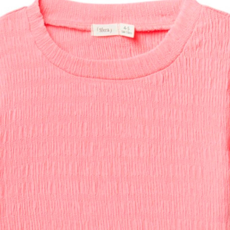 Blusa-rosada-solido-para-niña-104872160