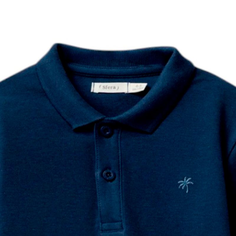 Camisa-polo-azul-solido-para-niño-104874900