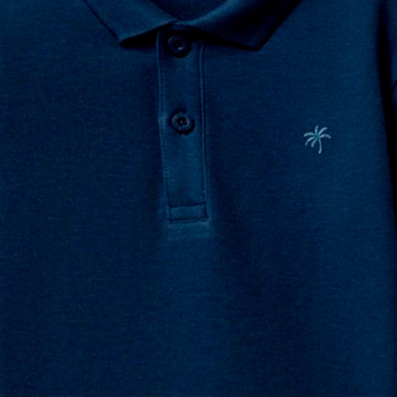 Camisa-polo-azul-solido-para-niño-104874900
