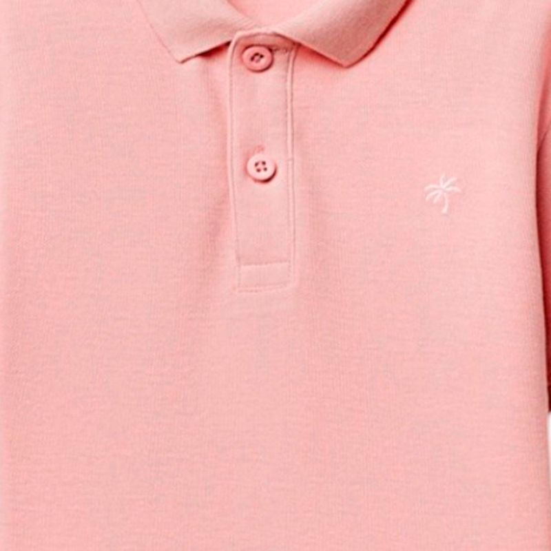 Camisa-polo-rosada-solido-para-niño-104874911