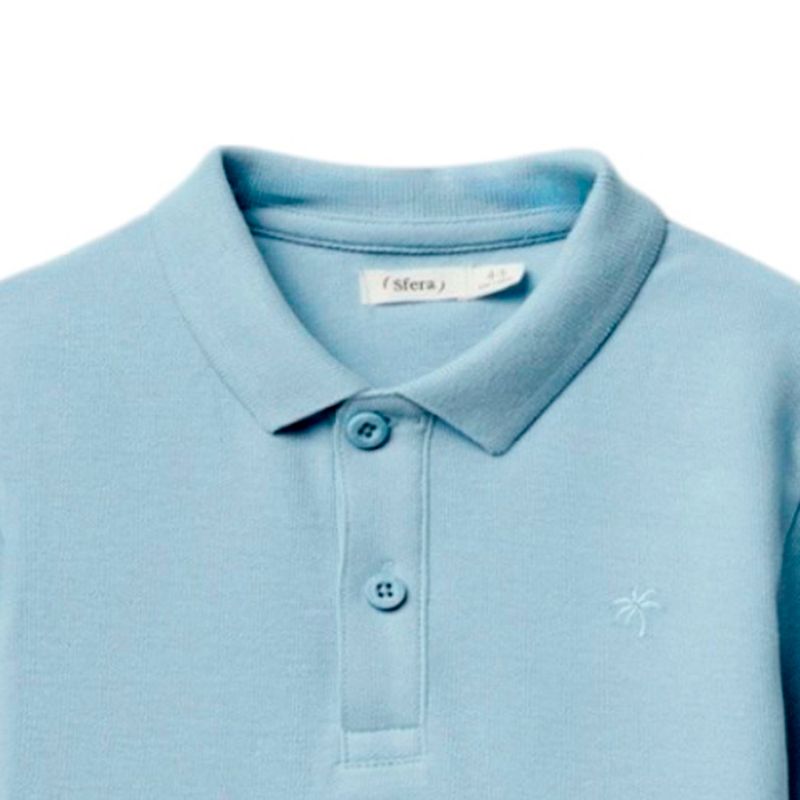 Camisa-polo-celeste-solido-para-niño-104874922