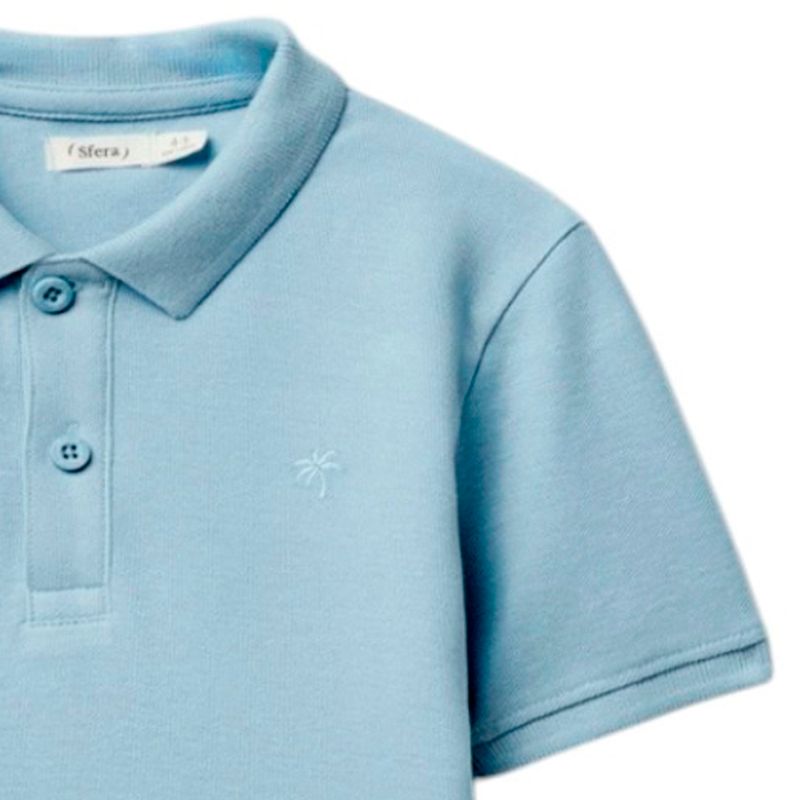 Camisa-polo-celeste-solido-para-niño-104874922