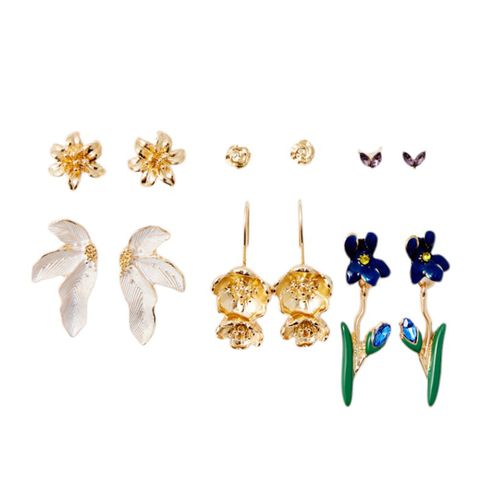 Set de 6 pares de aretes de flores color dorado para mujer