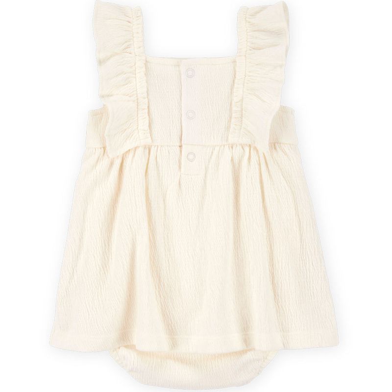 104893535-Vestido-beige-con-bordado-para-bebe-niña
