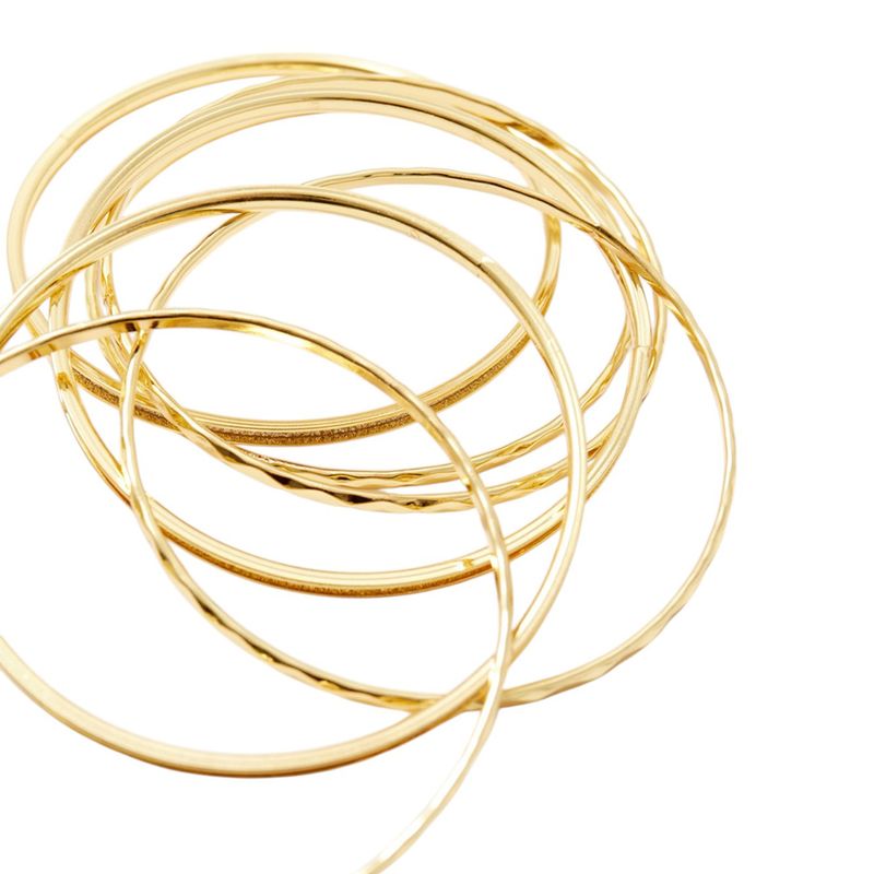 104917831-Set-de-pulseras-doradas-para-mujer