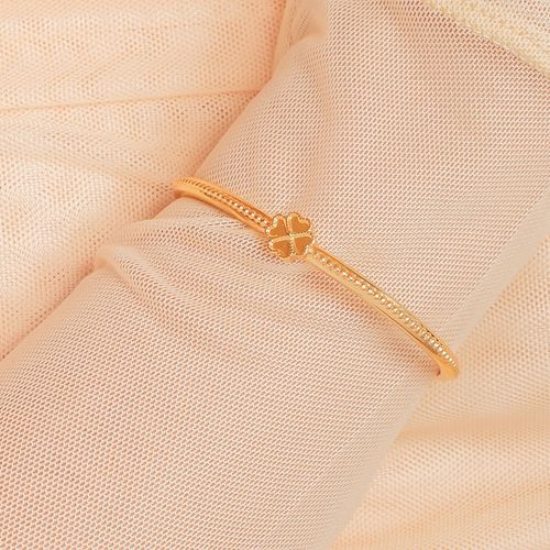 Brazalete rígido de trébol dorado para mujer