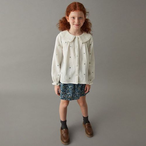 Falda short azul con estampado floral para niña