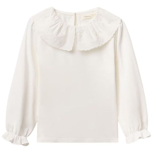 Blusa blanca con encaje para niña