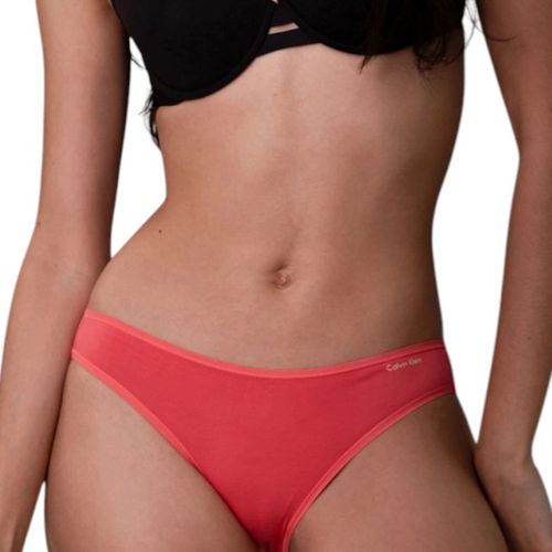 Bikini Calvin Klein anaranjado sólido cintura corta para mujer