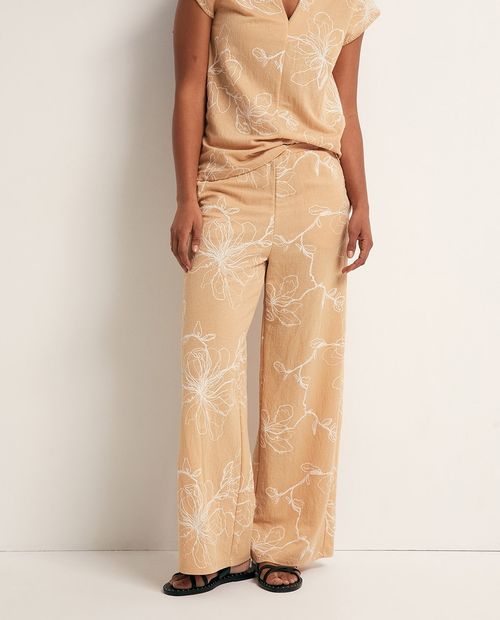 Pantalón wide leg beige con estampado floral