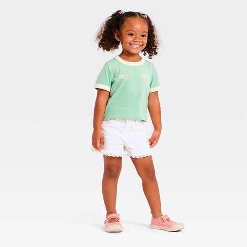 Camiseta verde con estampado de tenis para niña